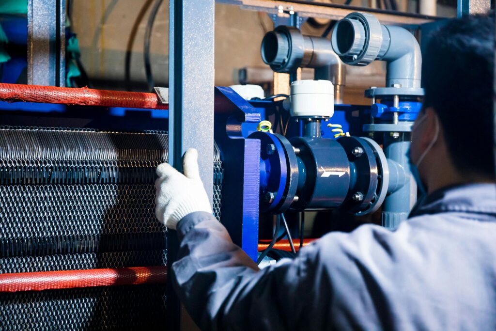 A Person Working with Industrial Machinery